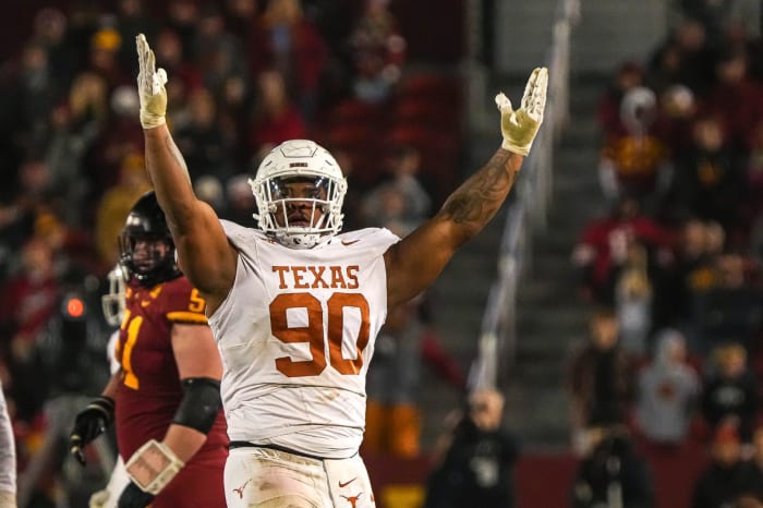 Texas Longhorns defensive lineman Byron Murphy II (90) celebrates sacking the Iowa State Cyclones quarterback during the game at Jack Trice Stadium.